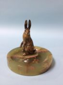 A cold painted bronze Hare, mounted on an onyx ashtray