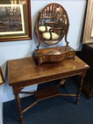 A mahogany dressing table mirror and a fold over tea table