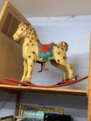 A tin rocking horse