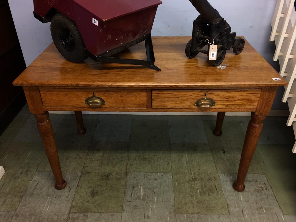 An oak two drawer desk