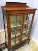 An Edwardian china cabinet