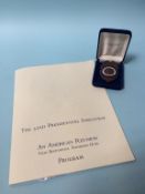 The 52nd Presidential Inauguration program and guest medal, together with a commemorative prize