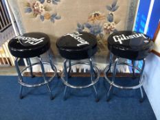 Three modern bar stools, each labelled 'Gibson'