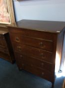 An oak chest of drawers