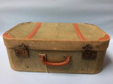 A green canvas suitcase and holdall