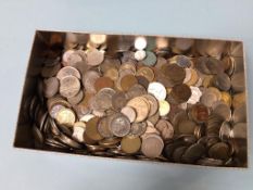 A tin of assorted coins