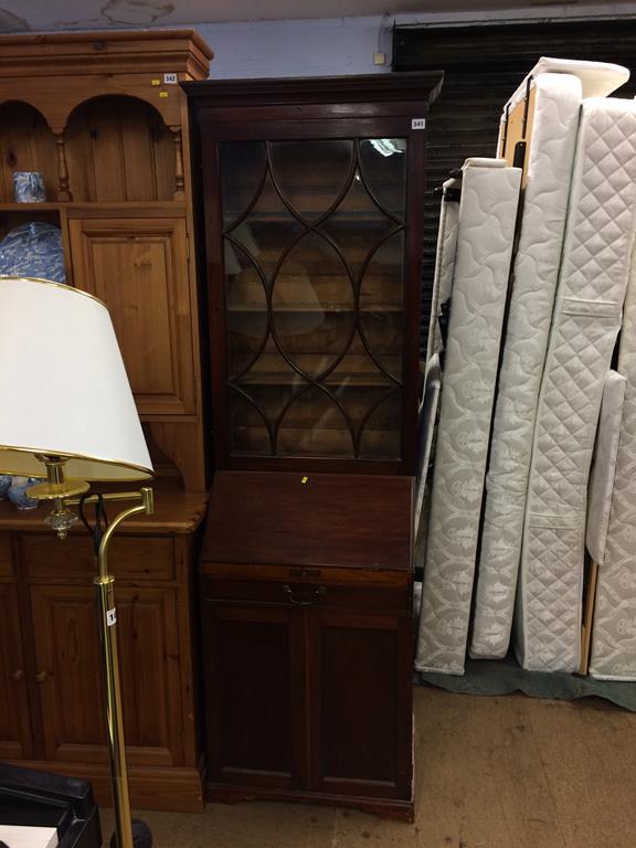 A narrow bureau bookcase