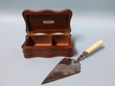 A silver plated presentation trowel, dated 1882 and a teakwood box from H. M. S. Nelson