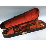 A violin and bow, in fitted 'coffin' case