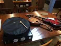 A Guinness 18" Bodhran pack, a mandolin and a Egmond guitar