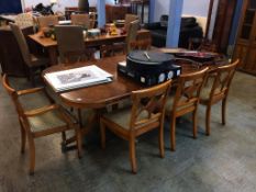 A Charles Barr Regency style dining table with eight chairs