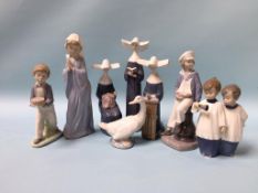 Four Lladro figures and four Nao figures