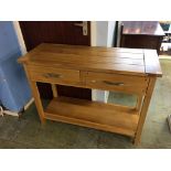 A pale oak two drawer side table