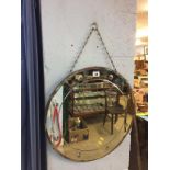 A Deco circular wall mirror