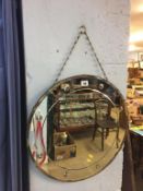 A Deco circular wall mirror