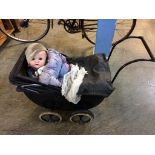 An Antique child's pram and a German doll, stamped 201/7