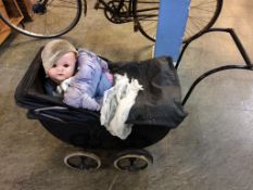 An Antique child's pram and a German doll, stamped 201/7