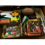 A box of retro badges and two boxes of toys