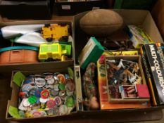 A box of retro badges and two boxes of toys