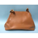 A tan brown leather Furla ladies hand bag
