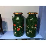 Two painted milk churns