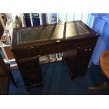 A small reproduction pedestal desk