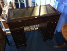 A small reproduction pedestal desk