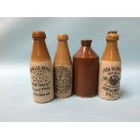 Three stoneware advertising bottles and one other (4)
