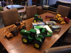 A large John Deer tractor, a Grain drill, a small John Deer tractor, a case digger, John Deer JCB