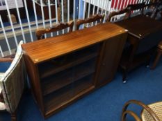 A G Plan teak coffee table, teak bookcase and a tea trolley