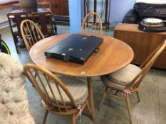 An Ercol Golden Dawn table and four hoop back chairs