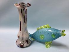 A coloured glass fish and a vase