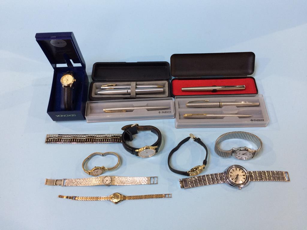 A quantity of Parker pens and a gents watch