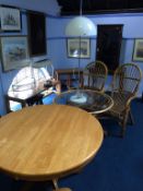 Three piece conservatory set, light wood circular breakfast table and a lamp