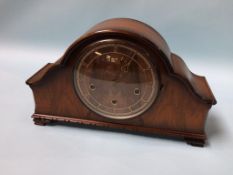 A walnut mantel clock