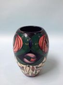 A Modern Moorcroft pottery vase, 18cm height