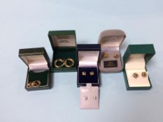 Four pairs of 9ct gold (stamped 375) earrings, weight 10.7g and a pair of 14ct gold earrings