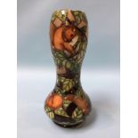 A Moorcroft vase with waisted body, decorated with squirrels, 28cm height