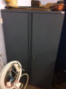 A grey metal two door cupboard