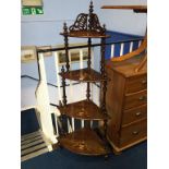 A Victorian walnut and marquetry four tier corner whatnot