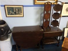 A tea trolley, two cake stands, and an oak gateleg table