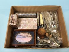 A box of cutlery, three boxes and a set of six napkin rings