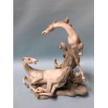 A large Lladro group of two prancing horses, approx. 40cm height