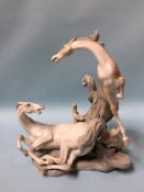 A large Lladro group of two prancing horses, approx. 40cm height