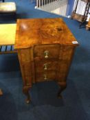 A walnut three drawer chest with cabriole legs, 40cm width