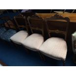 Three Edwardian walnut and marquetry chairs