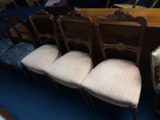 Three Edwardian walnut and marquetry chairs