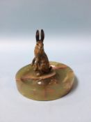 A cold cast painted bronze hare, mounted on an onyx base