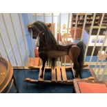 A wooden rocking horse