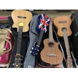 Four ukuleles in soft cases